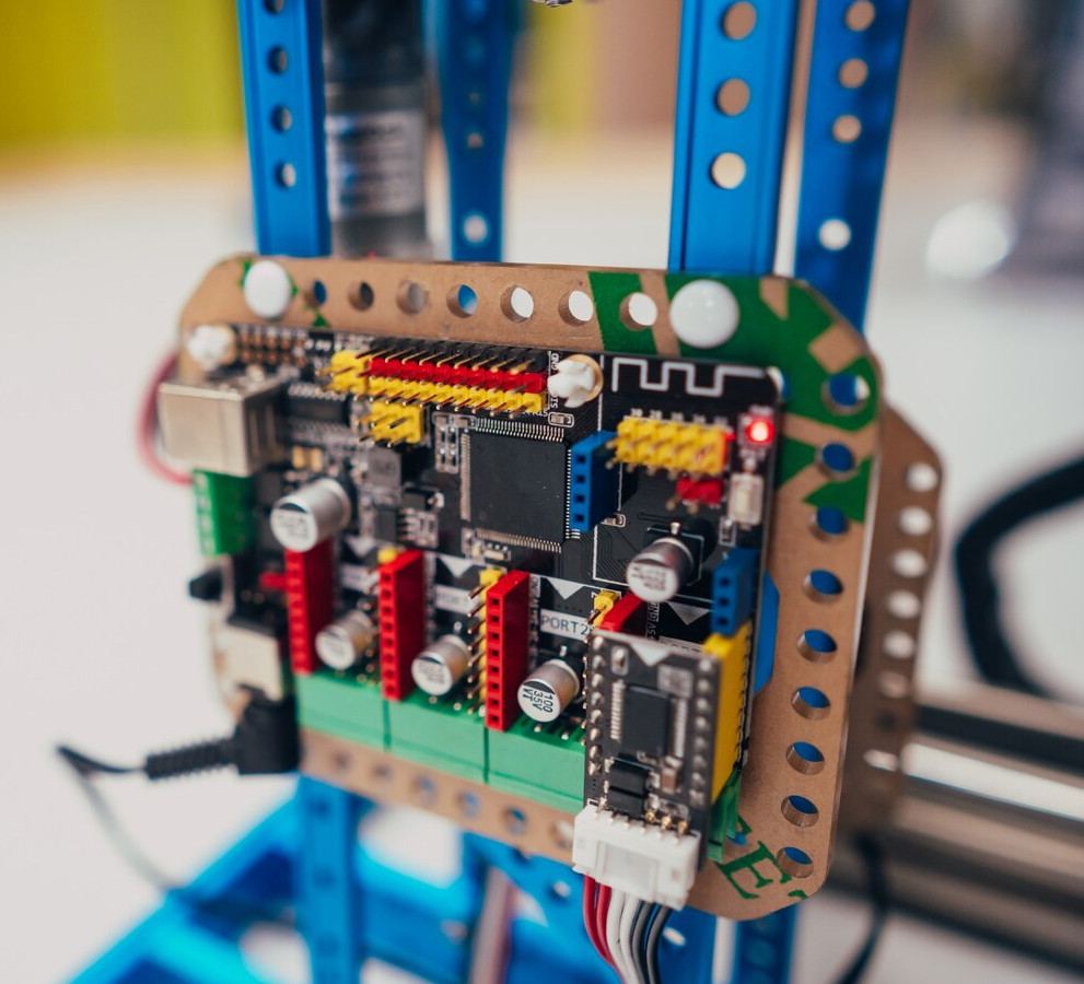 Close-up of a circuit board mounted on a blue frame