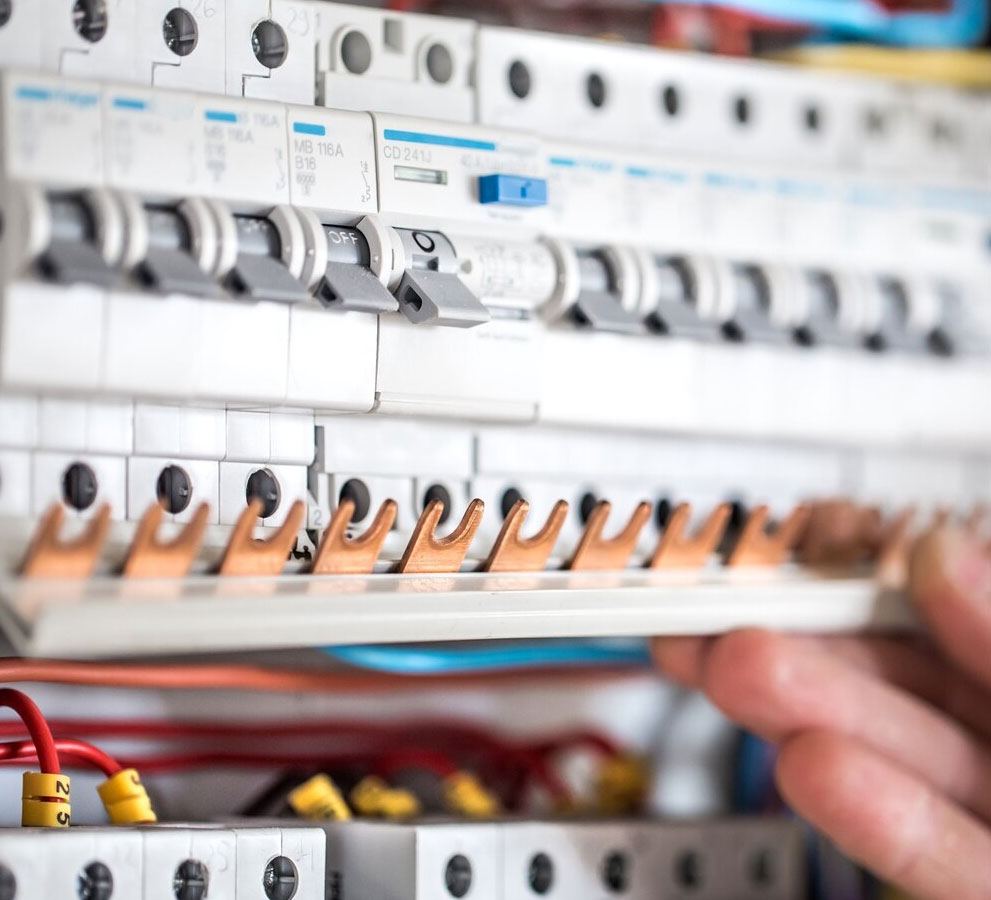 Fitting a copper busbar comb across a row of miniature circuit breakers
