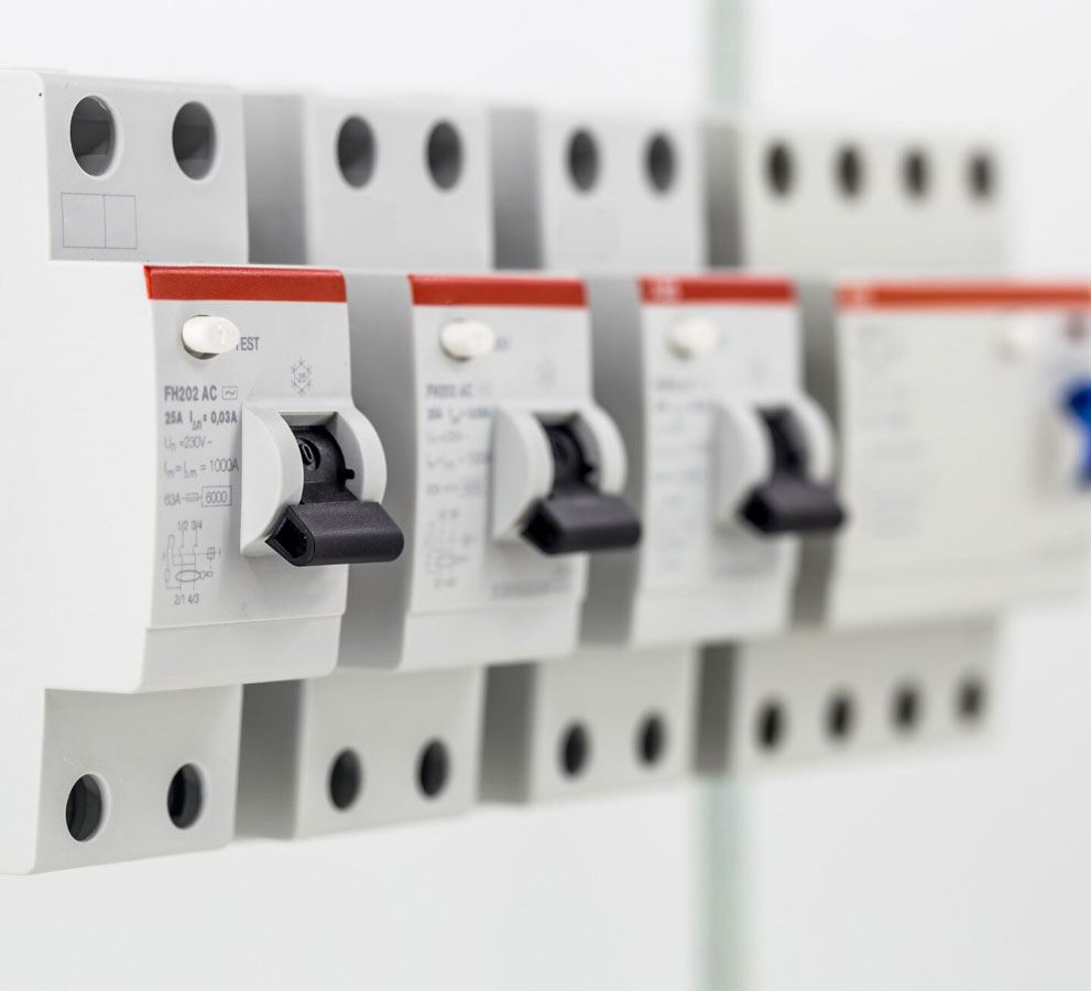 Close-up of double-pole RCDs mounted on a consumer unit rail