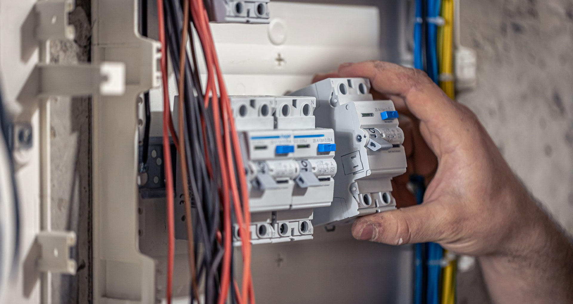 Close-up of an RCD being fitted into a Hager consumer unit